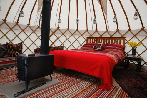 Luxury glamping interior of Roundhouse hire yurt.