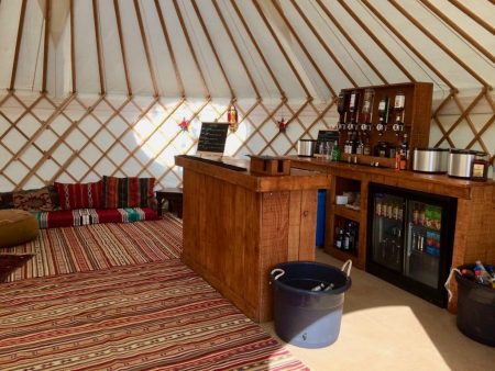 Roundhouse Yurt Hire with a Bar interior package.